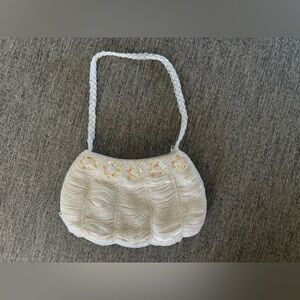 vintage small white beaded evening bag with a braided strap and floral sequin